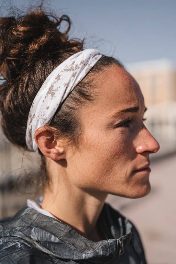 Low bun with headband running hairstyle for long hair