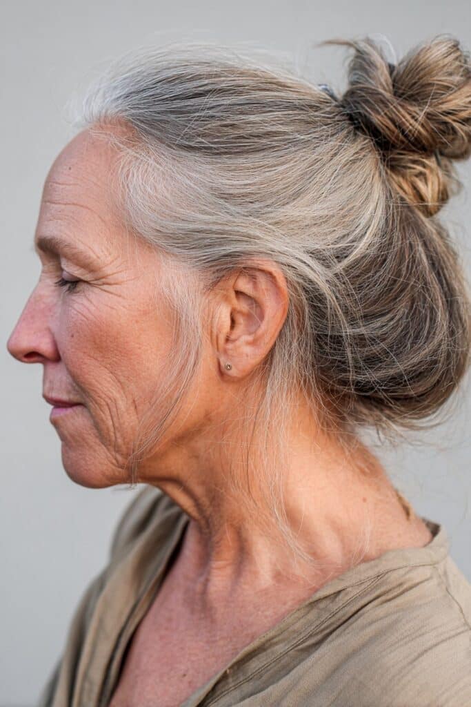Low knot bun easy hairstyle for older women with long hair