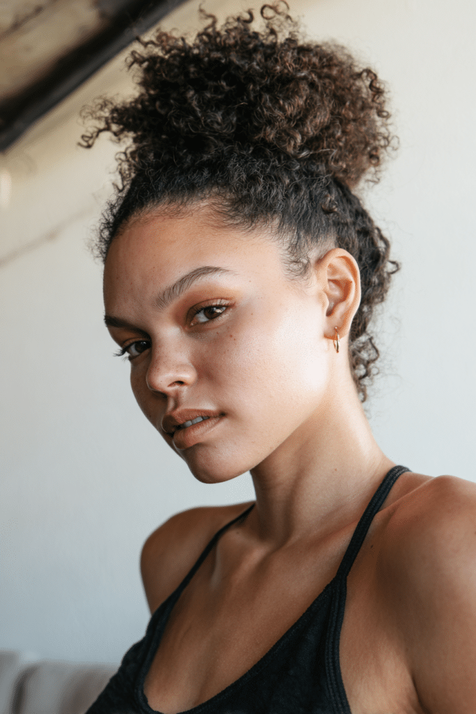 Pineapple updo for curls sweat proof hairstyle