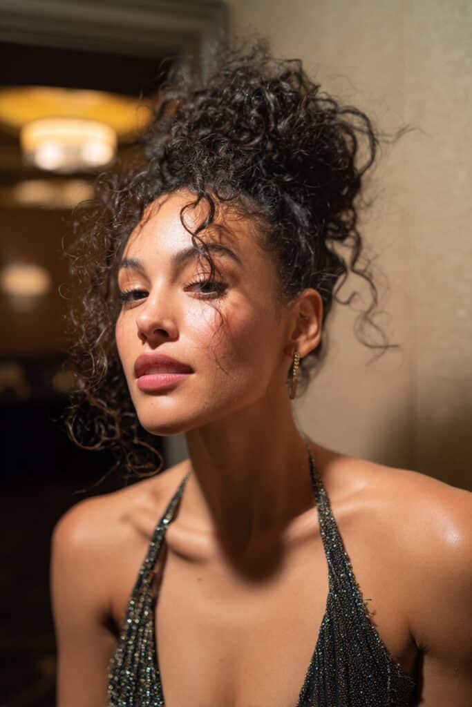 Voluminous curly updo formal prom hairstyle with lifted crown