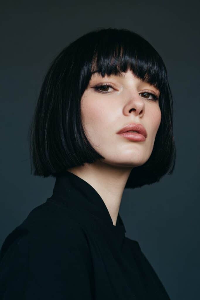 Textured choppy gothic bob haircut with edgy layers and no bang