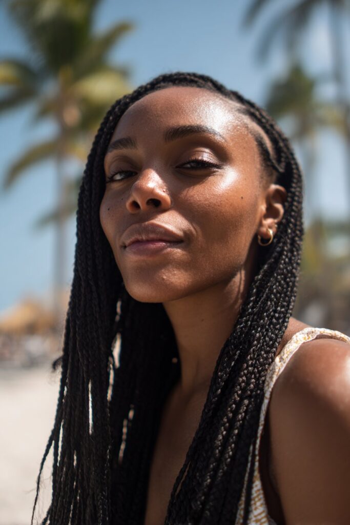 Box braids on Black woman, beach-ready vacation hairstyle