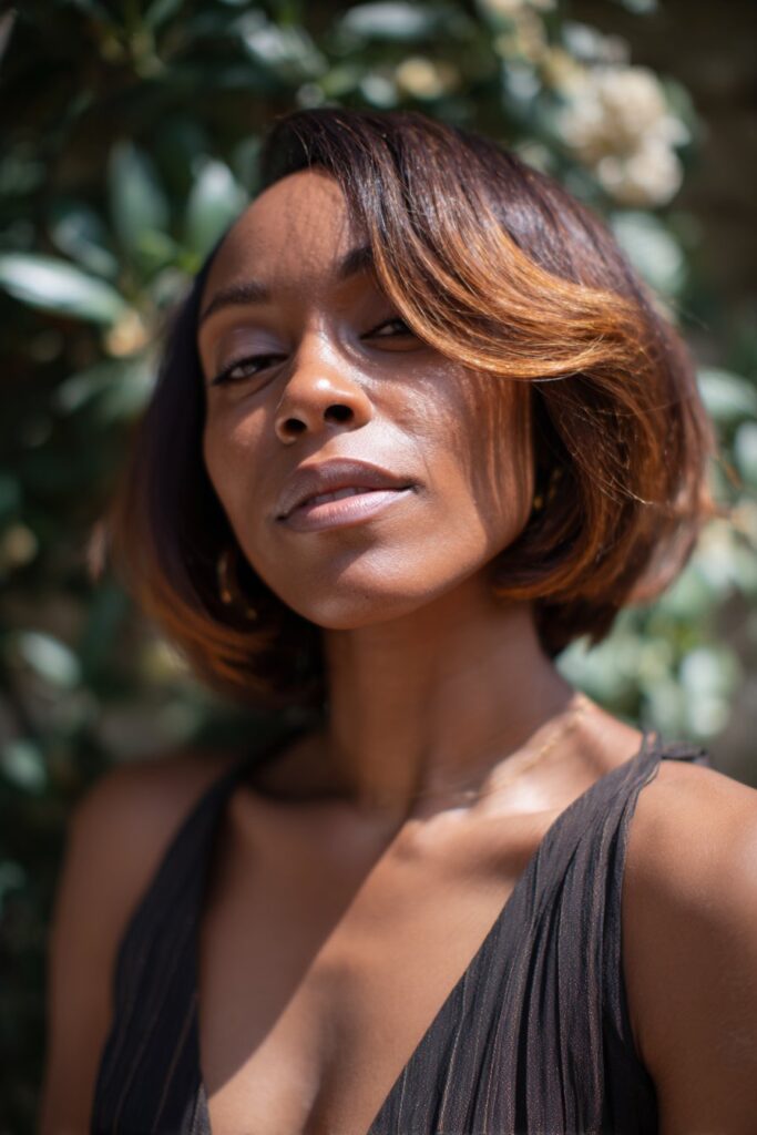 Chocolate brown bob with caramel highlights spring hairstyle for Black women