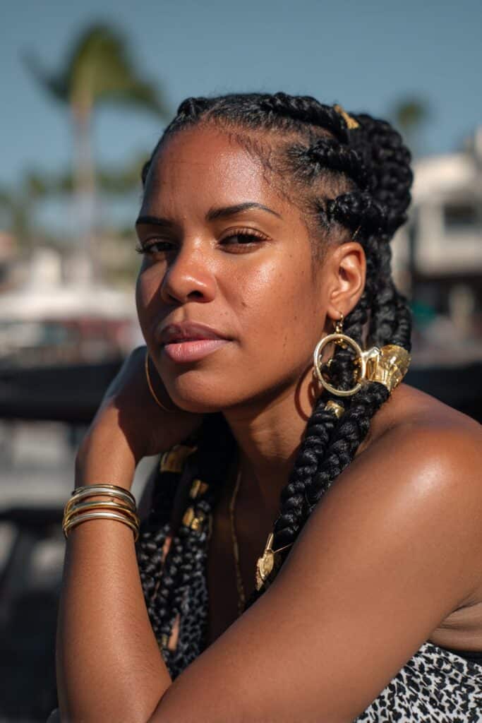 Passion twists on Black woman, flirty vacation hairstyle with movement