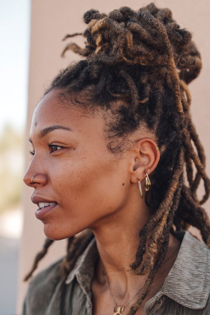 Half-up locs hairstyle with twisted details