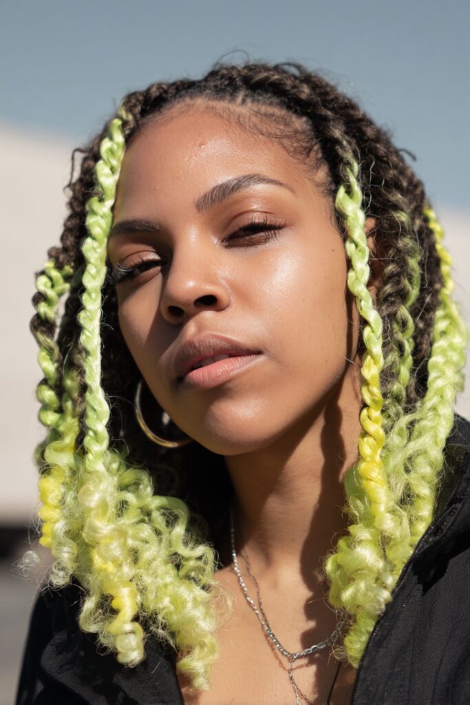 Lime green peekaboo braids with curly ends