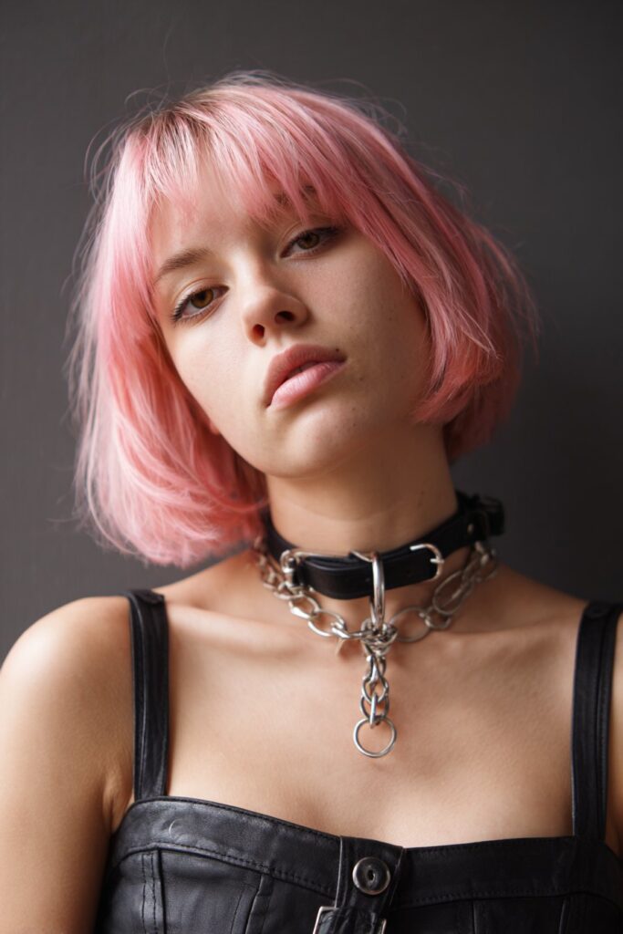 Neon pink statement goth bob haircut without fringe