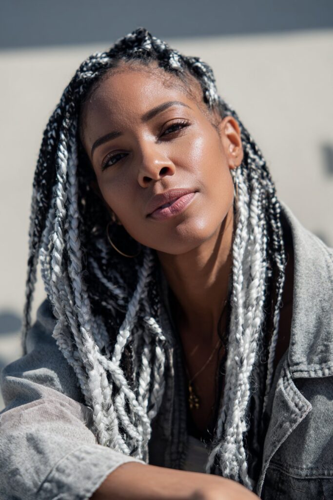 White and black peekaboo box braids with high contrast