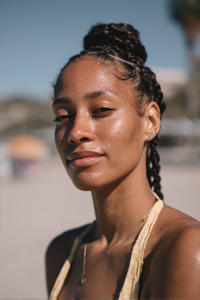 Braided headband low bun tanning hairstyle