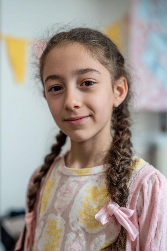 Cute braided hairstyle for kids side ponytail with ribbon