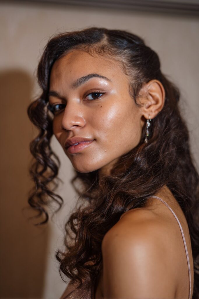 Prom hairstyle side part with cascading side curls