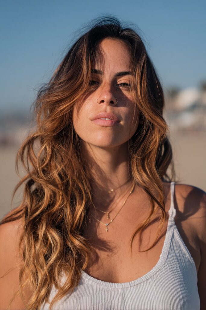 Dimensional sunkissed brunette hair with soft blended highlights