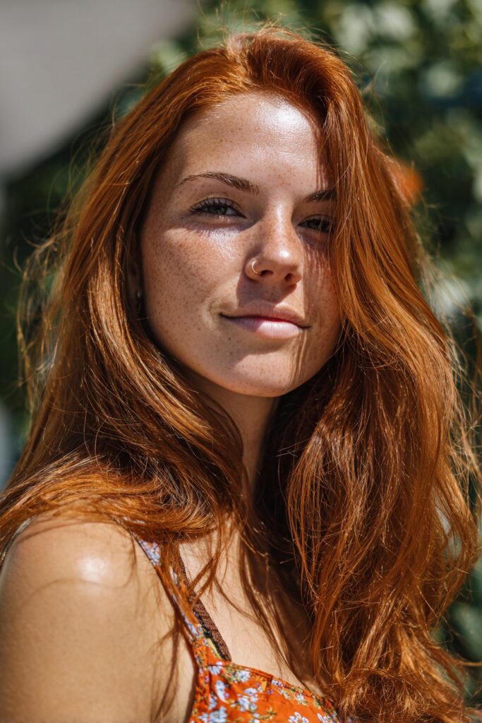 Light auburn summer red hair color with natural shine