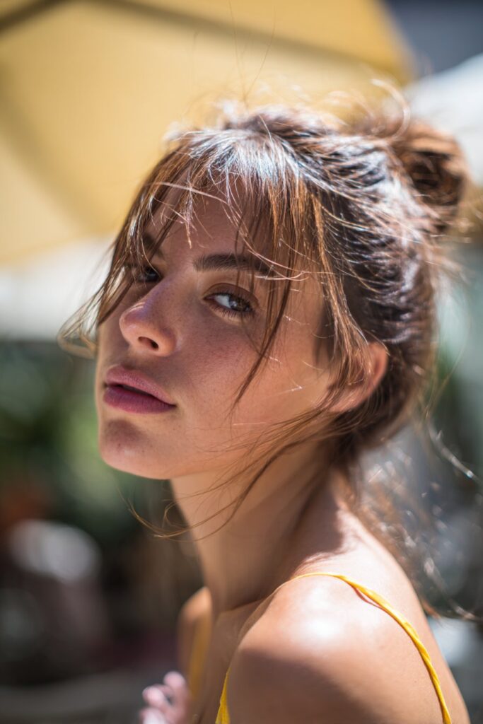 12 Stunning Summer Hairstyles for Long Hair You’ll Love 1 Messy low bun summer hairstyle for long hair