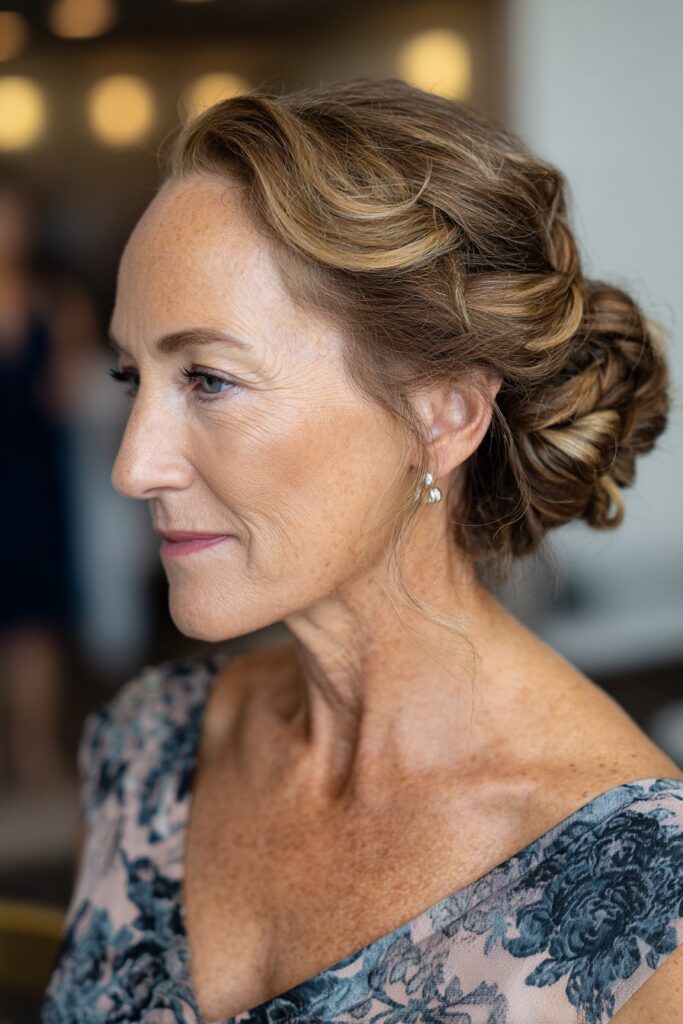 Side bun mother of the groom hairstyle with twisted details