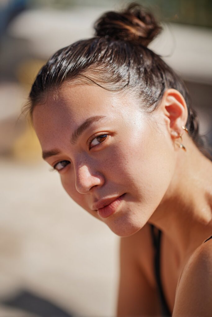 Slicked back low bun cute summer hairstyle