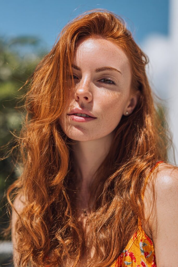 Tangerine red summer hair color with vibrant tone