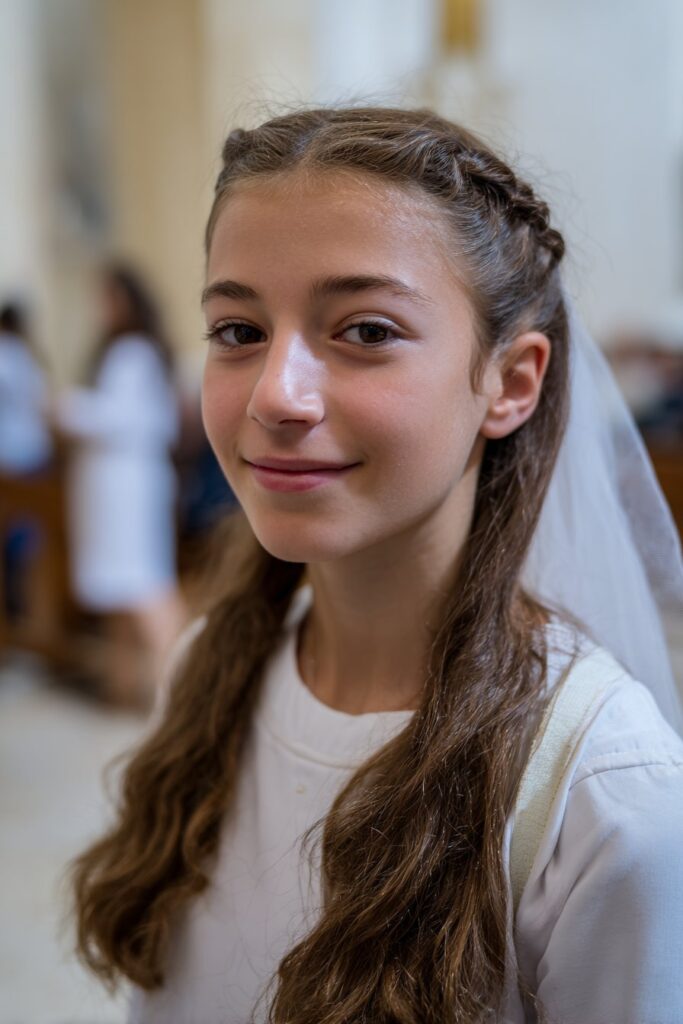 First communion hairstyle with veil French braid