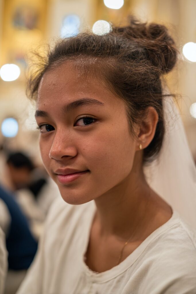 First communion hairstyle with veil messy bun