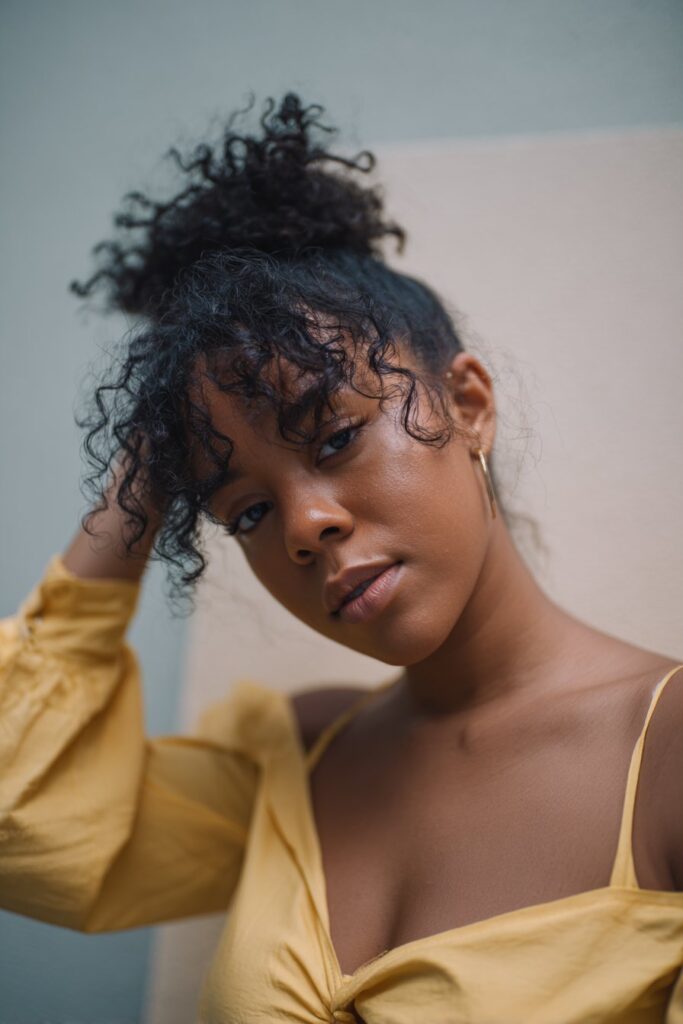 Natural updo hairstyles black women faux hawk curls