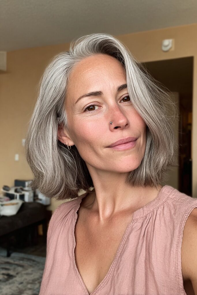 Chic asymmetrical bob hairstyle for women over 50, realistic portrait.