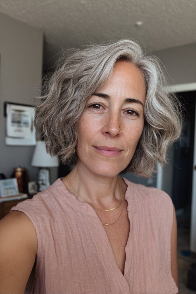 12 Choppy Hairstyles for Older Women (Effortlessly Youthful) 9 Older woman with asymmetrical bob haircut