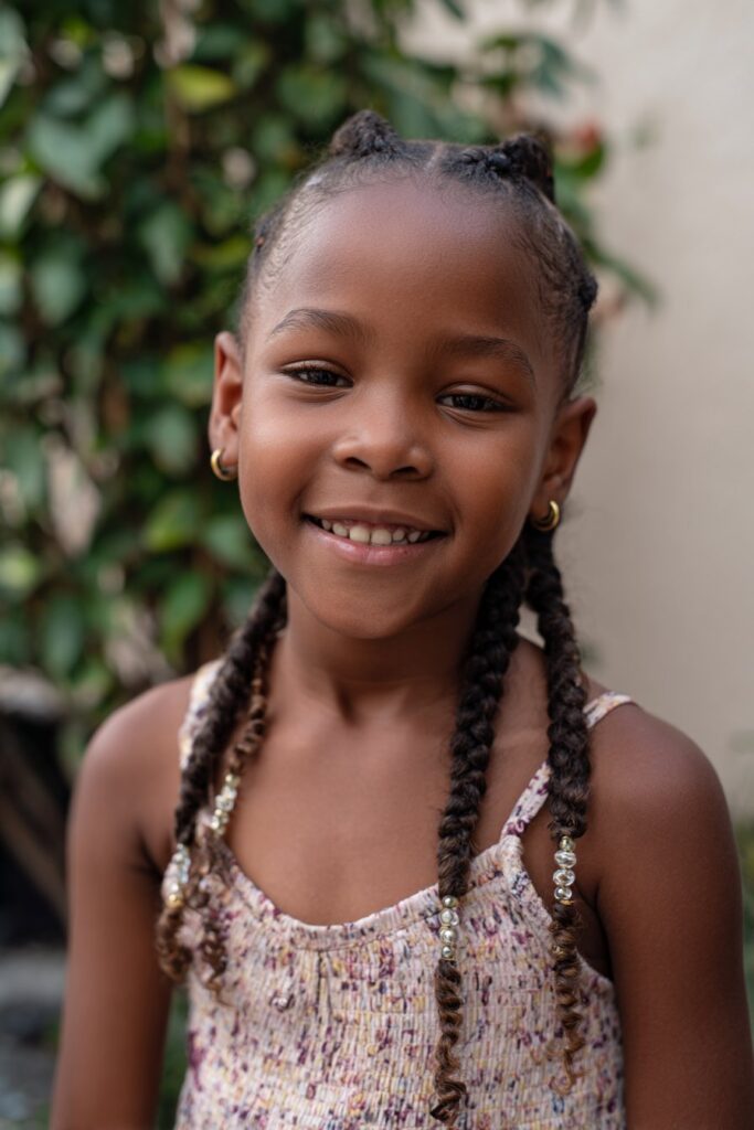Kid braided ponytail low braid curly ends
