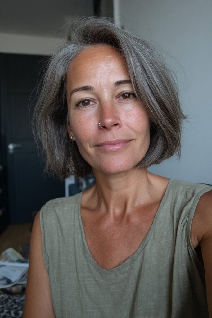 Side-swept bob hairstyle for elegant women over 50, realistic portrait.