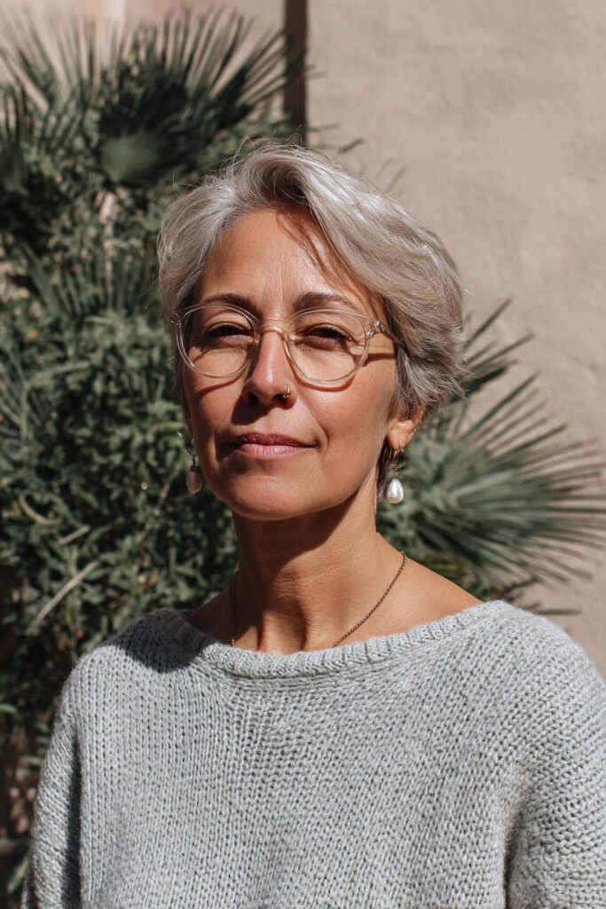 25 Short Hairstyles for Women Over 50 With Glasses 12 Silver textured pixie with glasses