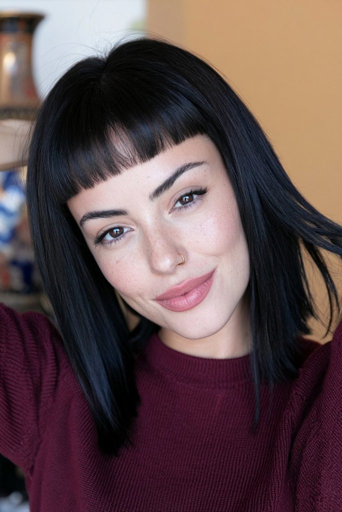 Blunt bangs jellyfish haircut with sharply defined layered lengths
