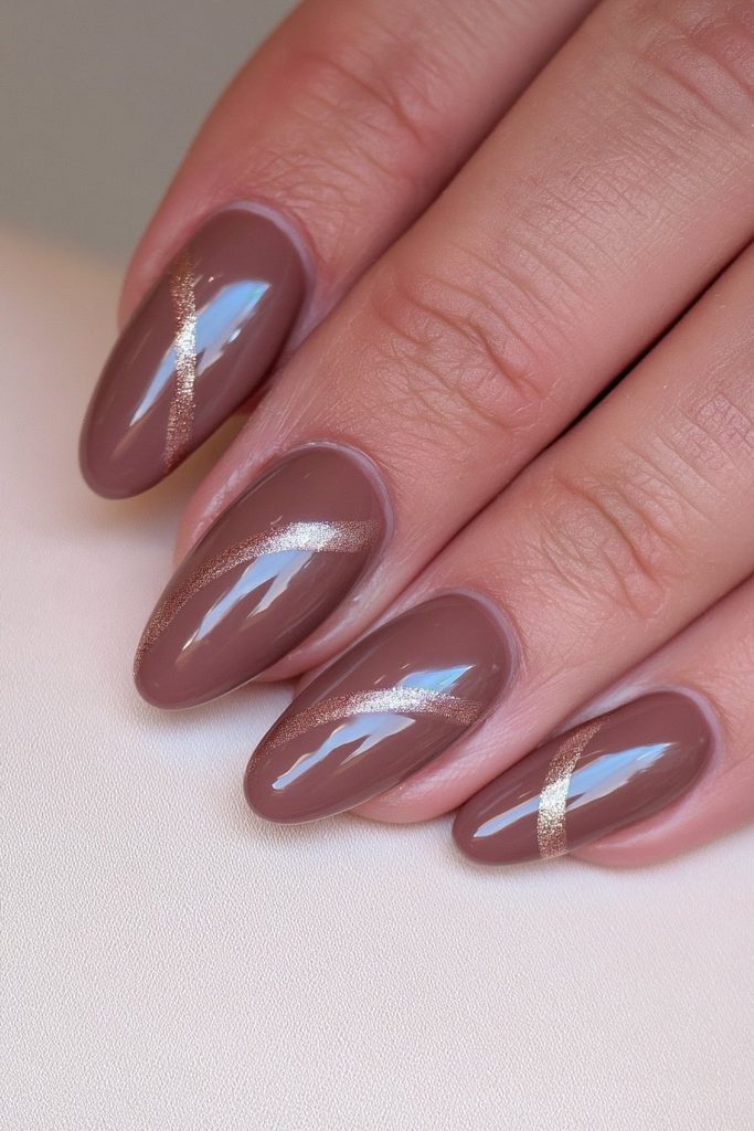 Chocolate nails with elegant curved gold arc accent