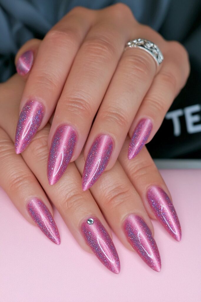 Mid-pink cat-eye rhinestone glitter nails