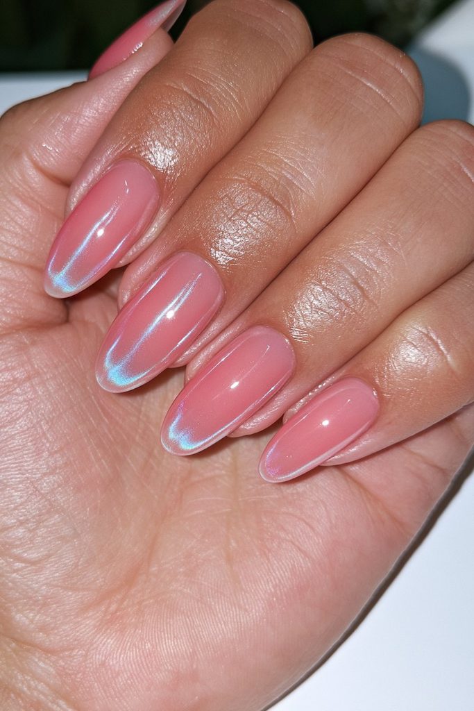 Glossy glazed almond nails with soft reflective pearl shine