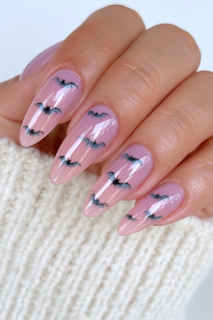 20 Pink Halloween Nails For This Spooky Season 5 Pink nails with tiny black bats
