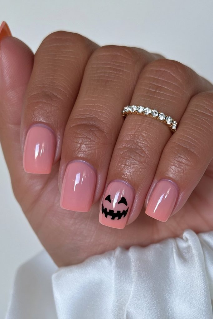 25 Almond Halloween Nails That Are Spooky, Not Over-the-Top 4 Pumpkin face accent nail