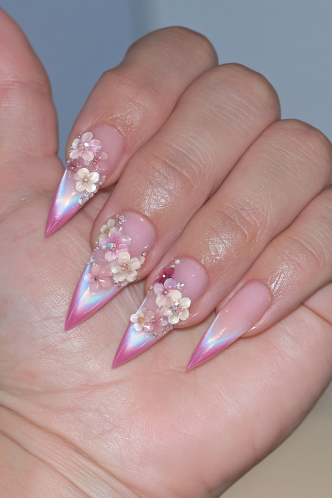 Stiletto nails featuring dimensional 3D floral nail art