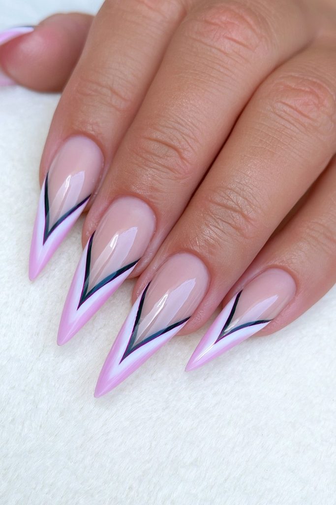 Black French stiletto nails with sleek nude base