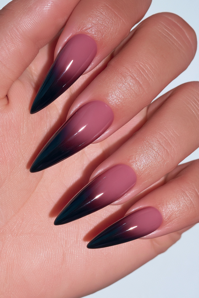 Black jelly stiletto nails with sheer glossy translucent finish