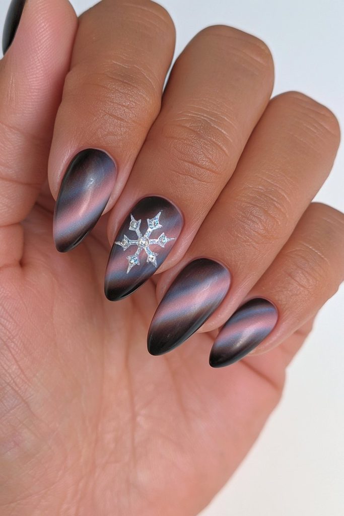 20 Glamorous Snowflake Nail Ideas to Sparkle Through Winter 13 Black velvet snowflake accent nail