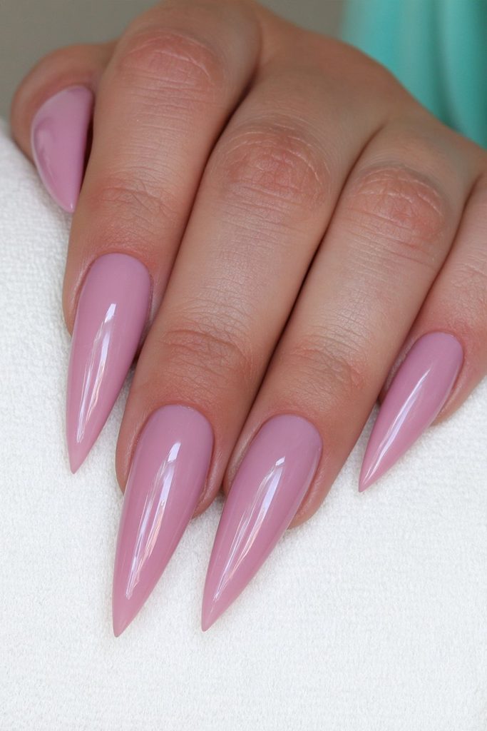 Blush pink stiletto nails with soft feminine glossy finish