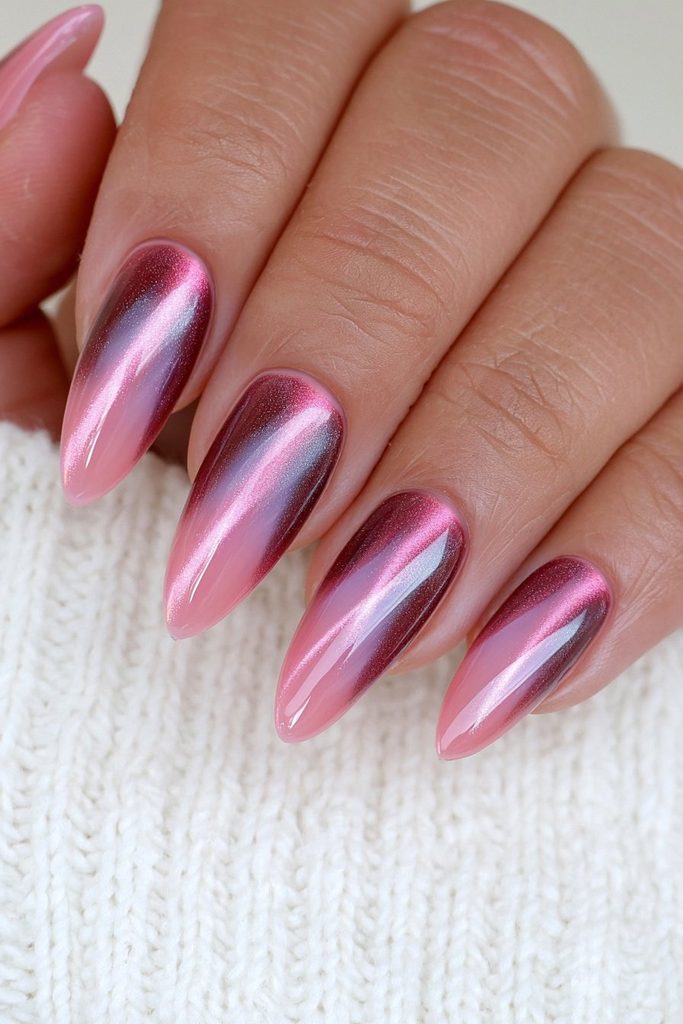 Deep burgundy cat-eye nails with luxurious magnetic glow
