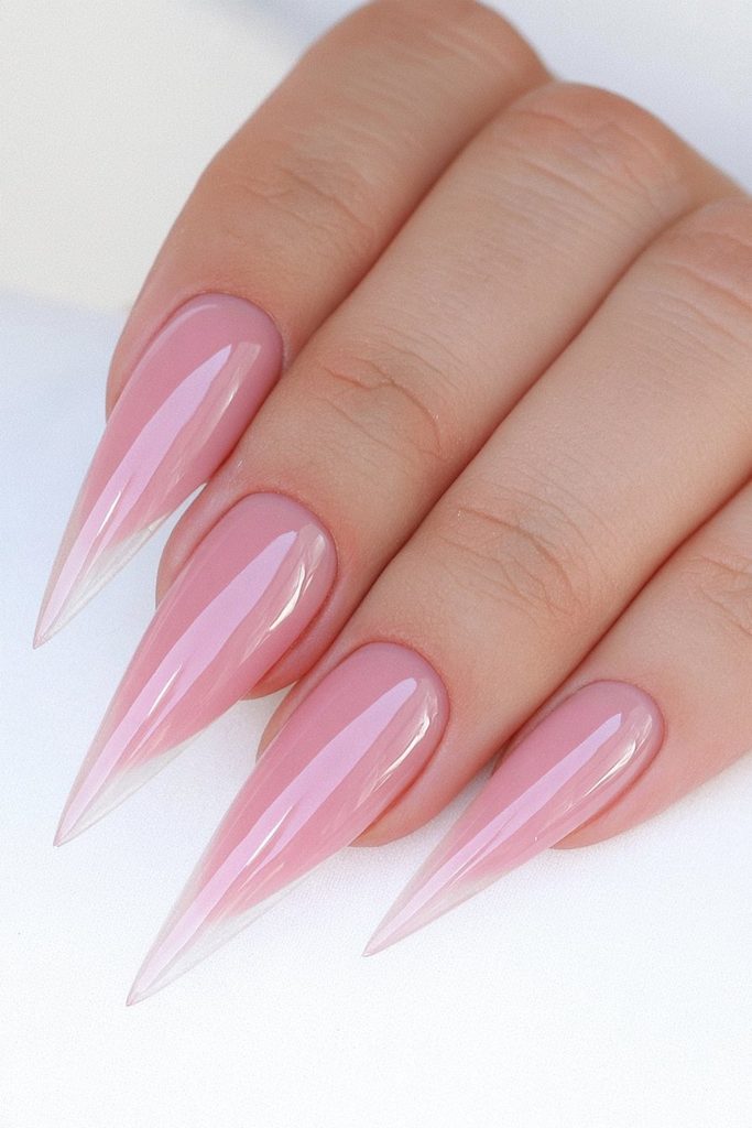 Caramel cream stiletto nails with warm glossy neutral finish