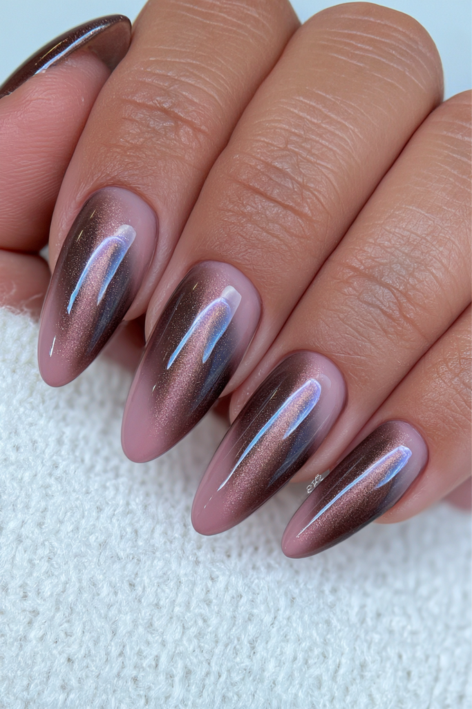 Dark brown cat-eye almond nails with warm magnetic shine