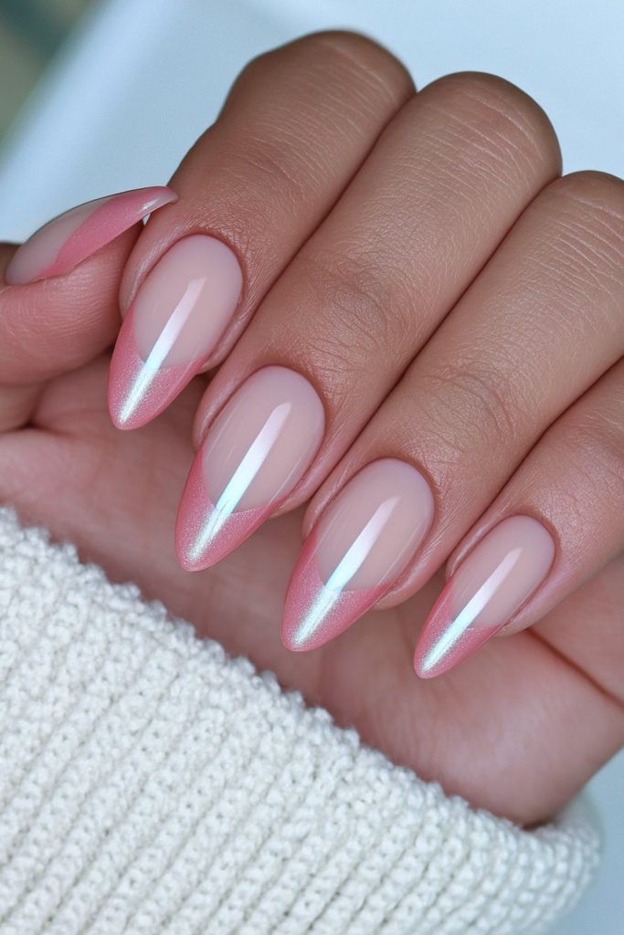 Elegant French tips featuring subtle glowing cat-eye shimmer