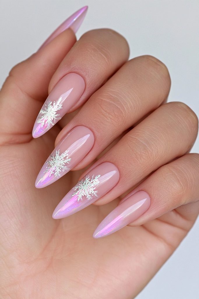 Chrome nails featuring reflective silver snowflake accent designs