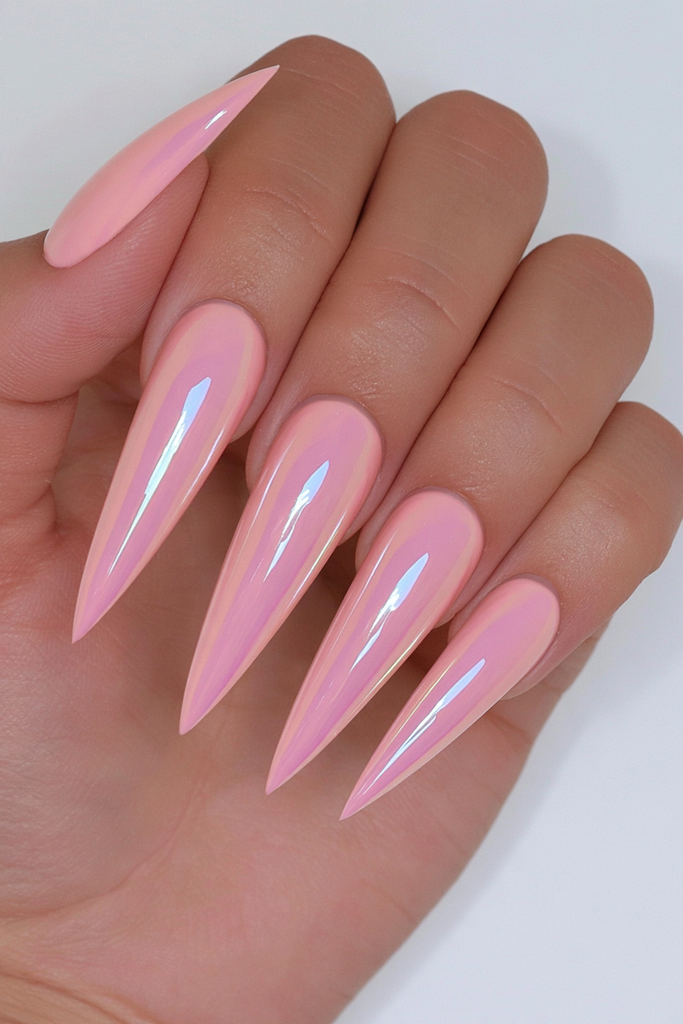 Coral chrome stiletto nails with vibrant reflective metallic shine