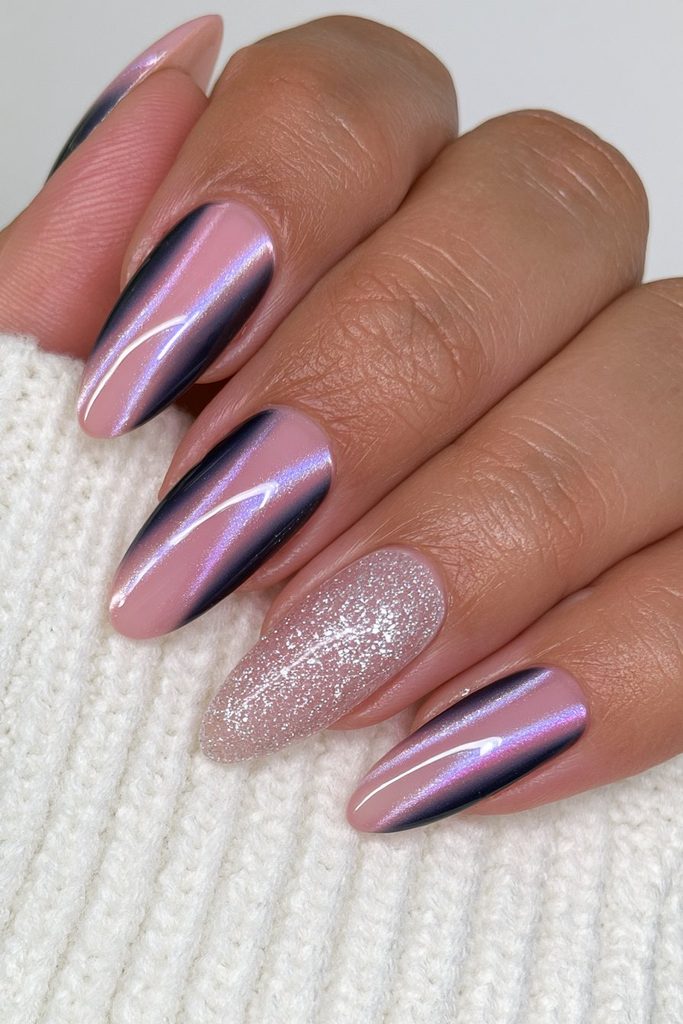 Deep navy cat-eye nails with sparkling silver glitter accents