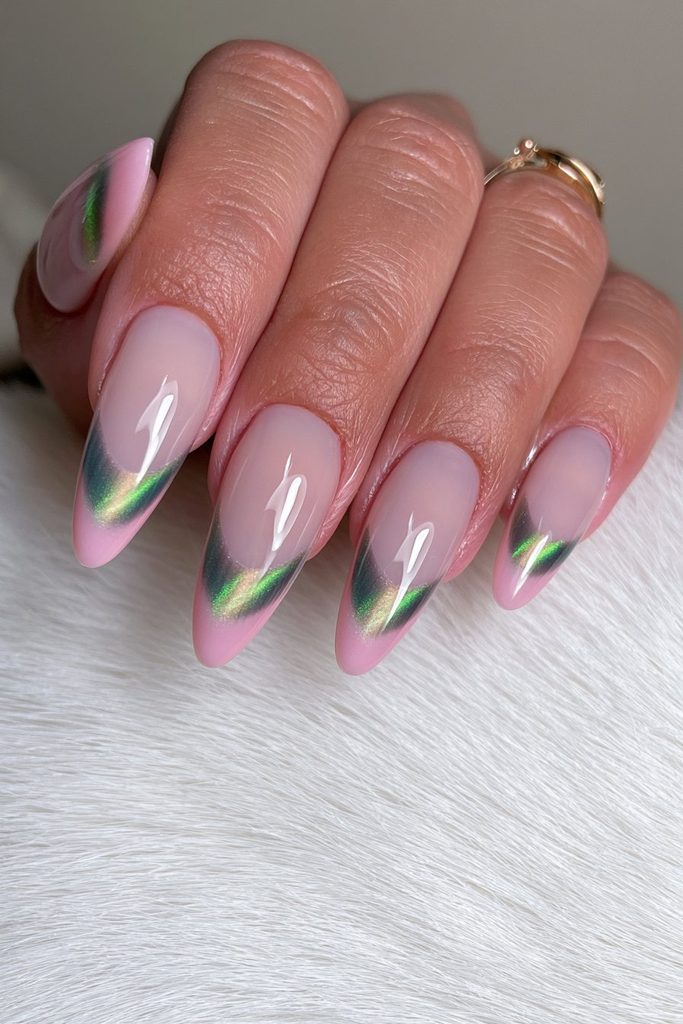 Emerald green cat-eye French tips with magnetic shimmer
