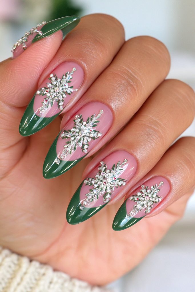 Emerald and silver nails featuring elegant shimmering snowflake designs