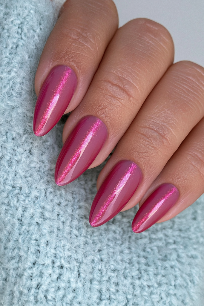 Garnet cat-eye nails with rich jewel-toned magnetic shimmer